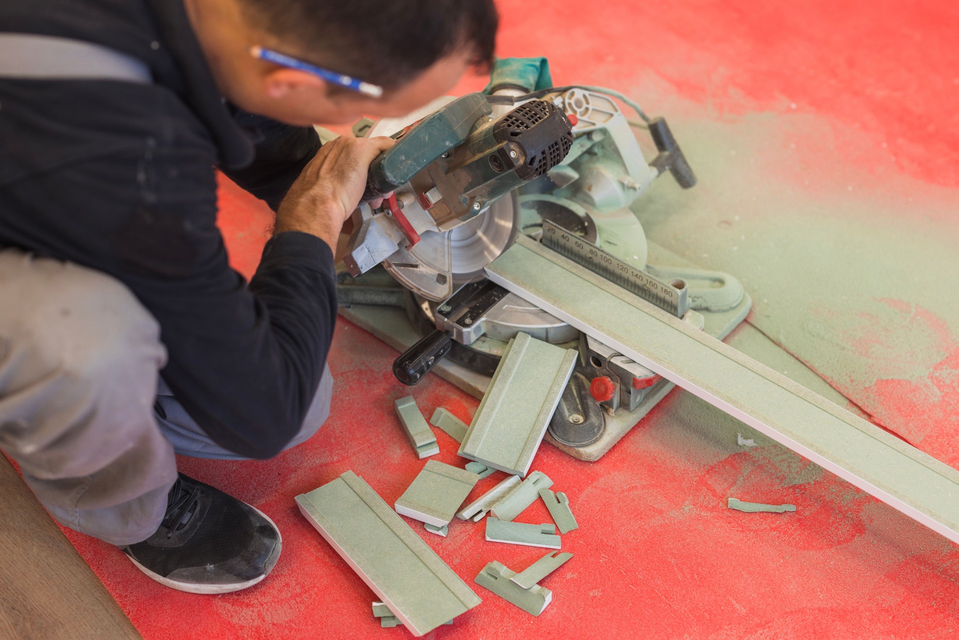 Handyman using circular saw when working on a hardwood floor